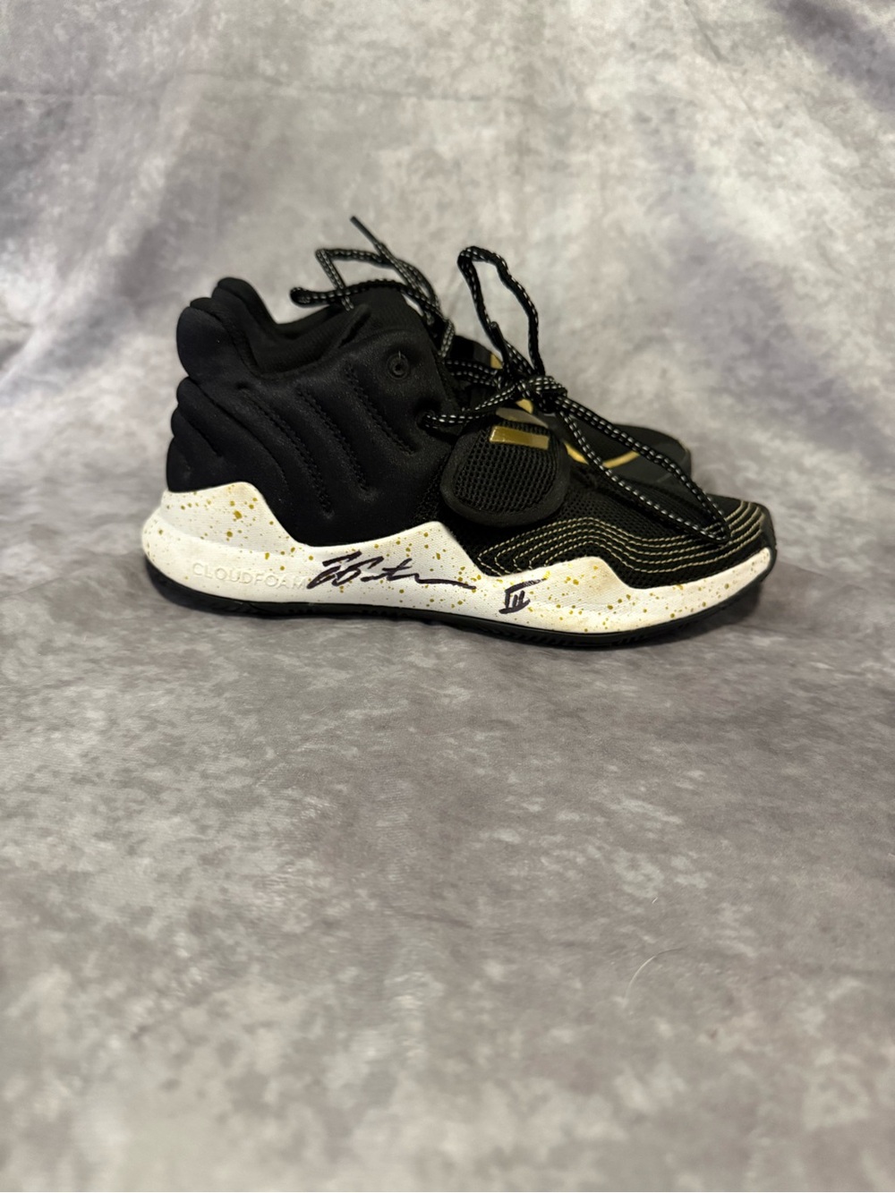 Kids Adidas Black and White Athletic Sneakers with Gold Accents